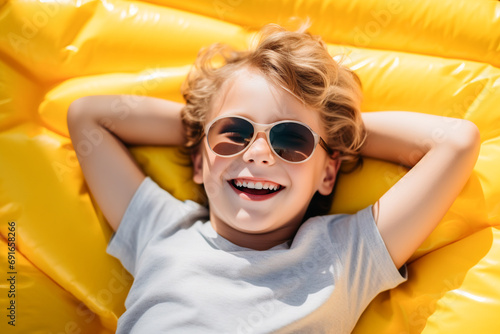 Joyful Child Relaxing on Yellow Float. Generative AI photo