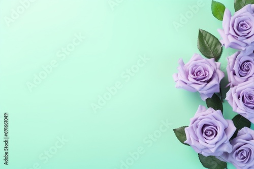 Mint Green Roses Flower Border Over a Lavender Background With Copy Space. Copy space.