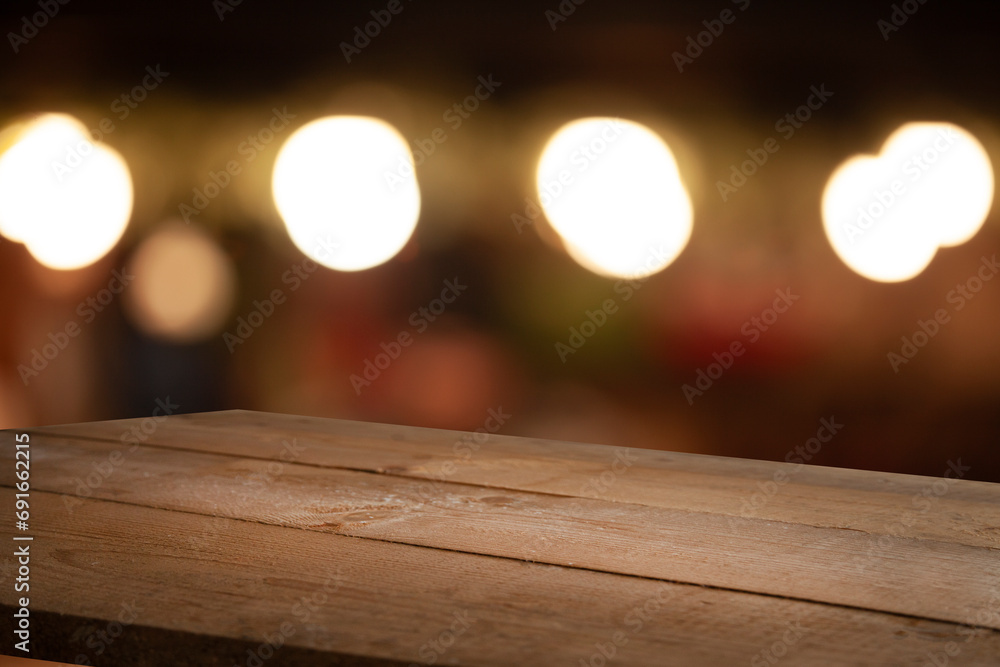 Empty dark wooden table in front of restaurant abstract blurred bokeh background. can be used to demonstrate or mount your products. Layout for space Empty dark wooden table in front of restaurant abstract blurred bokeh background. can be used to demonstrate or mount your products. Layout for space