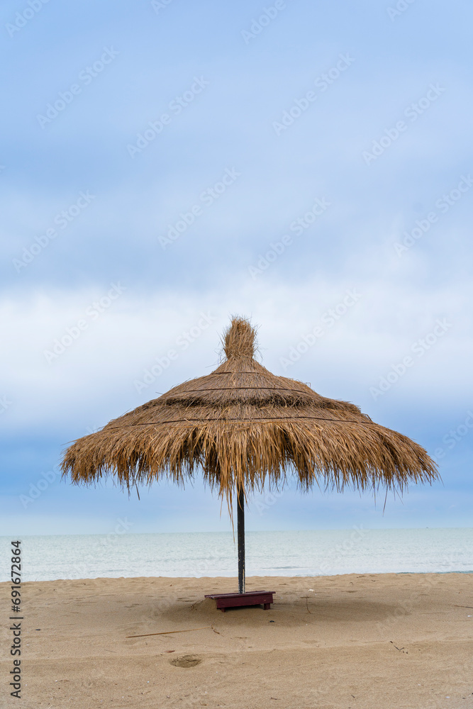 Adriatic sea, Albania coast beautiful sky,  straw umbrella