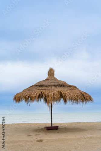 Adriatic sea  Albania coast beautiful sky   straw umbrella