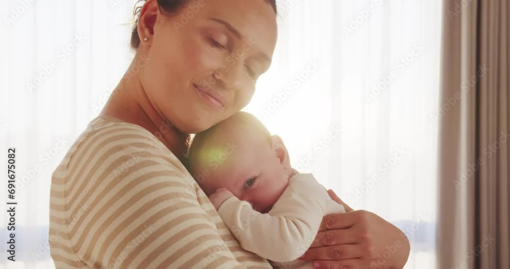 Happy adult mother is kissing newborn baby while holding him on her hands. Happiness of a loving mother's kiss.  Mother kissing baby's face. Mum loves and  cares of her infant baby.