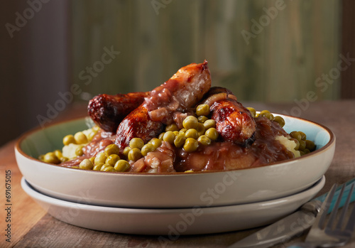 Cumberland sausage with mashed potatoes ,garden peas and a rich onion gravy.