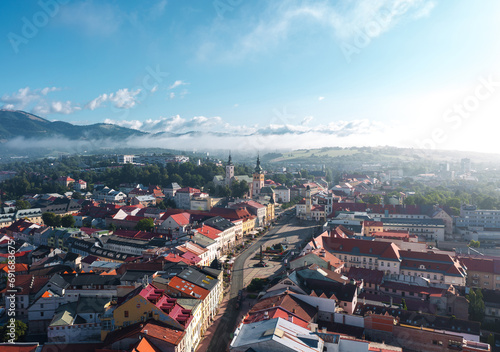 Obraz na płótnie Panoramic aerial cityscape of Banská Bystrica old town, travel destination city in central Slovakia, located on the Hron River in a long and wide valley encircled by the mountain chains w salonie