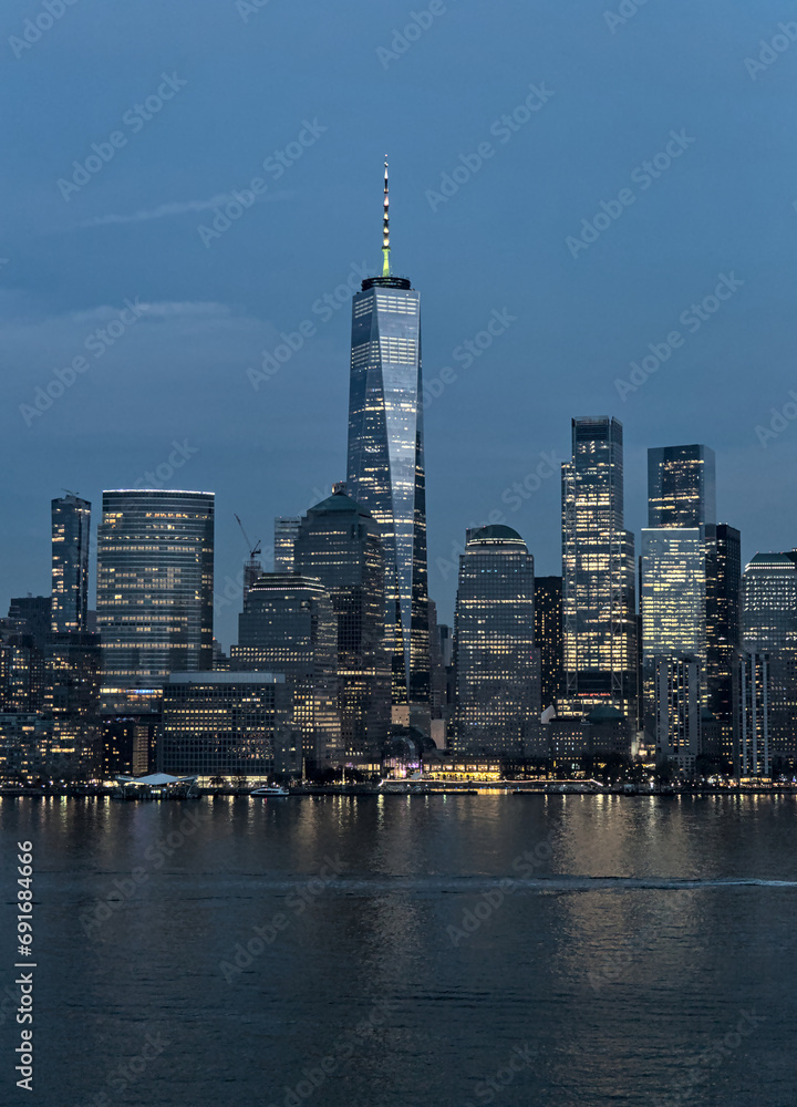 Naklejka premium downtown manhattan skyline view (new york from jersey city) travel tourism destination (after sunset, dusk, night, dark) water reflection in hudson river (world trade center detail)