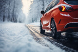 a car wheels on the background of a winter road and a beautiful landscape, a snow-covered forest, a concept of traffic safety on a slippery road