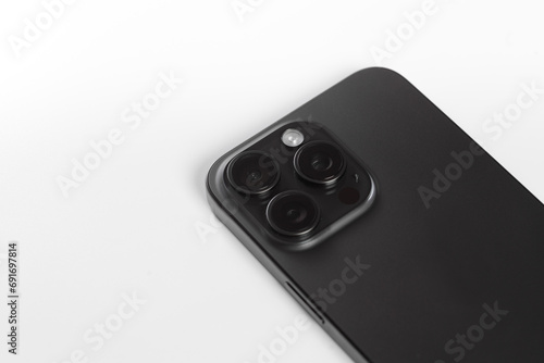black smartphone with white wireless headphones, Iphone 15 pro max Black Titanium