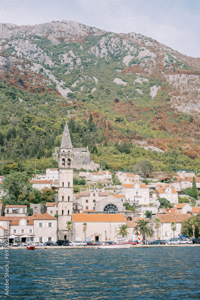 View from the sea of the high bell tower of the Church of St. Nicholas on the coast of Perast. Montenegro