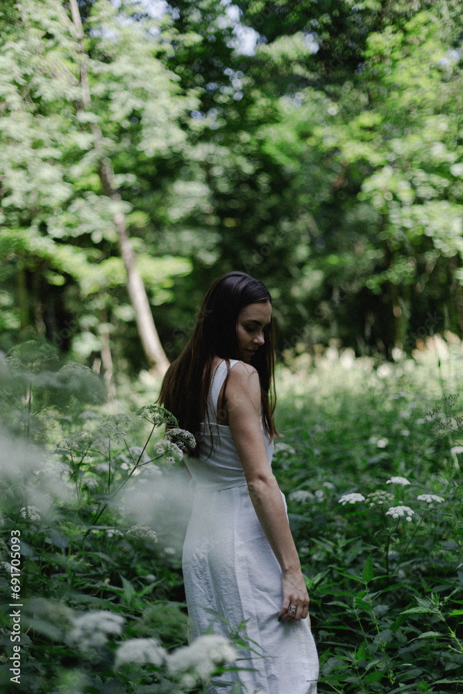 portrait of a woman in white dress in the forest portrait of a woman in white dress in the forest