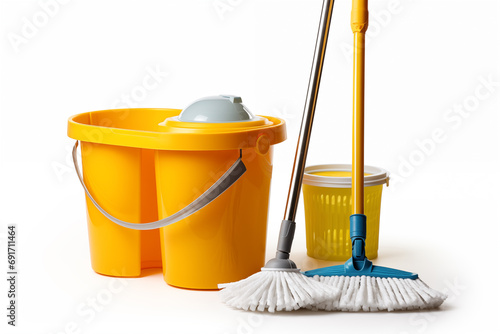 Yellow bucket and mops for cleaning on white background.