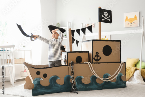 Cute little pirate playing ...