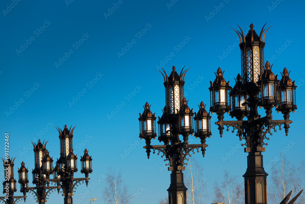 Vintage street lamps at sunset