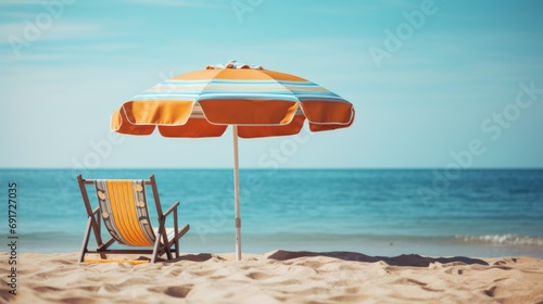 Two chairs and an umbrella on a beach.