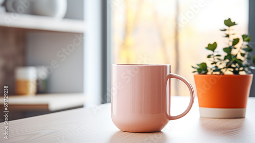 A minimalist Peach Fuzz 2024 mug by a window, with soft daylight and a potted plant, creates a peaceful morning scene.
