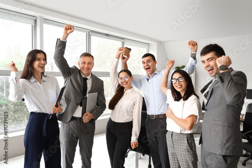 Happy business colleagues w...