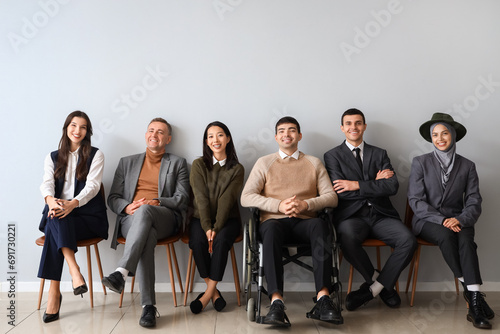 Business people sitting nea...