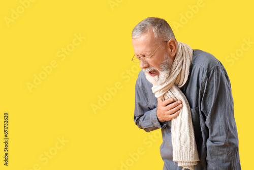 Sick mature man in scarf sn...