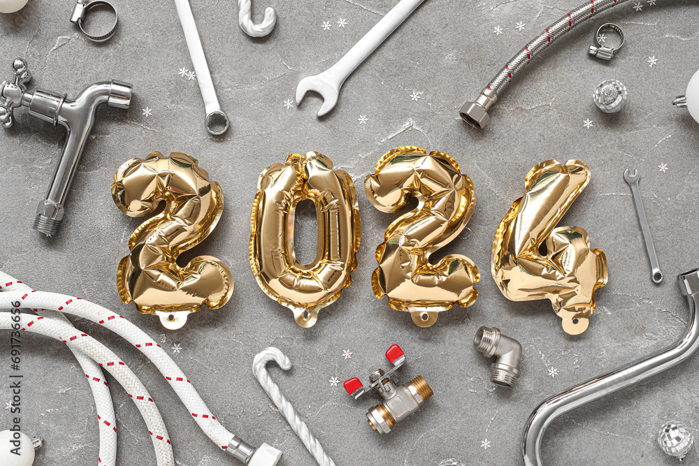 Composition with figure 2024 made of balloons, plumber's items and Christmas decor on grunge background Composition with figure 2024 made of balloons, plumber's items and Christmas decor on grunge background