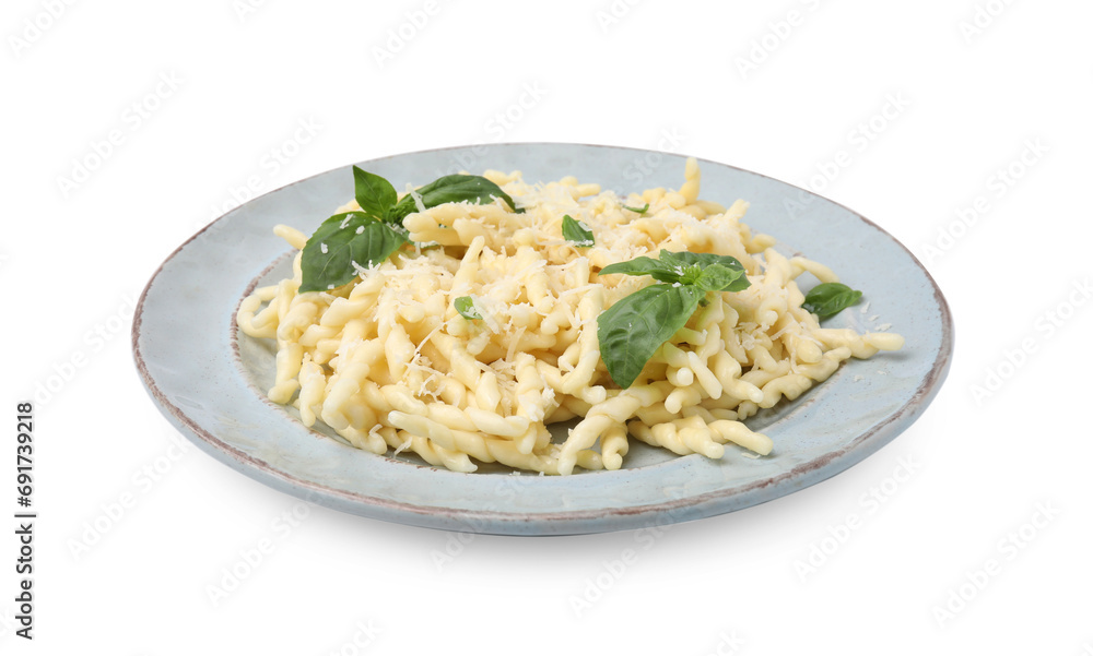 Plate of delicious trofie pasta with cheese and basil leaves isolated on white