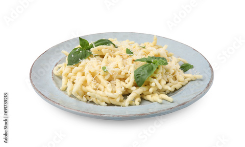 Plate of delicious trofie pasta with cheese and basil leaves isolated on white