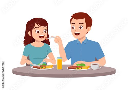 young couple man and woman eat meat steak together