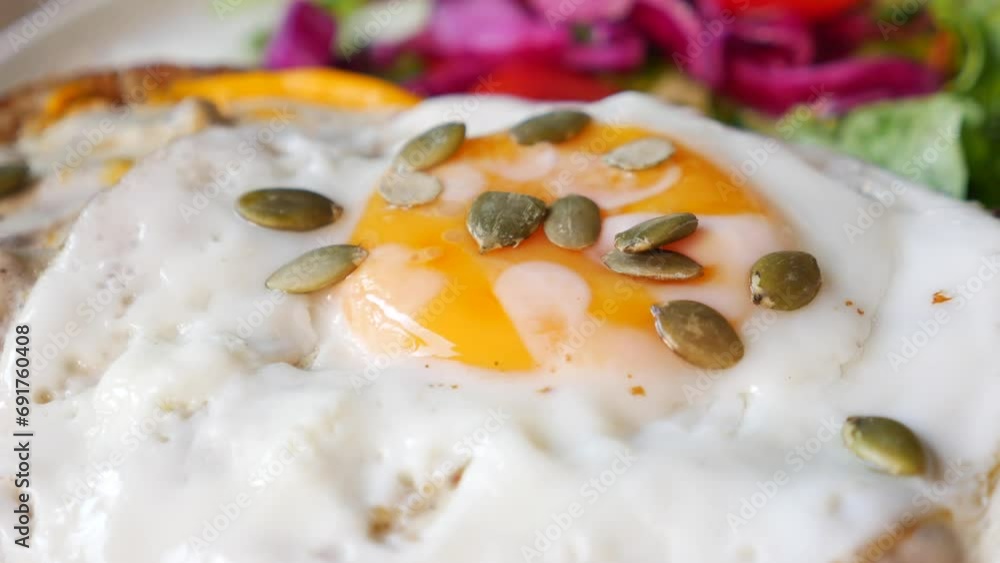 Fried eggs on served with green herbs Fried eggs on served with green herbs