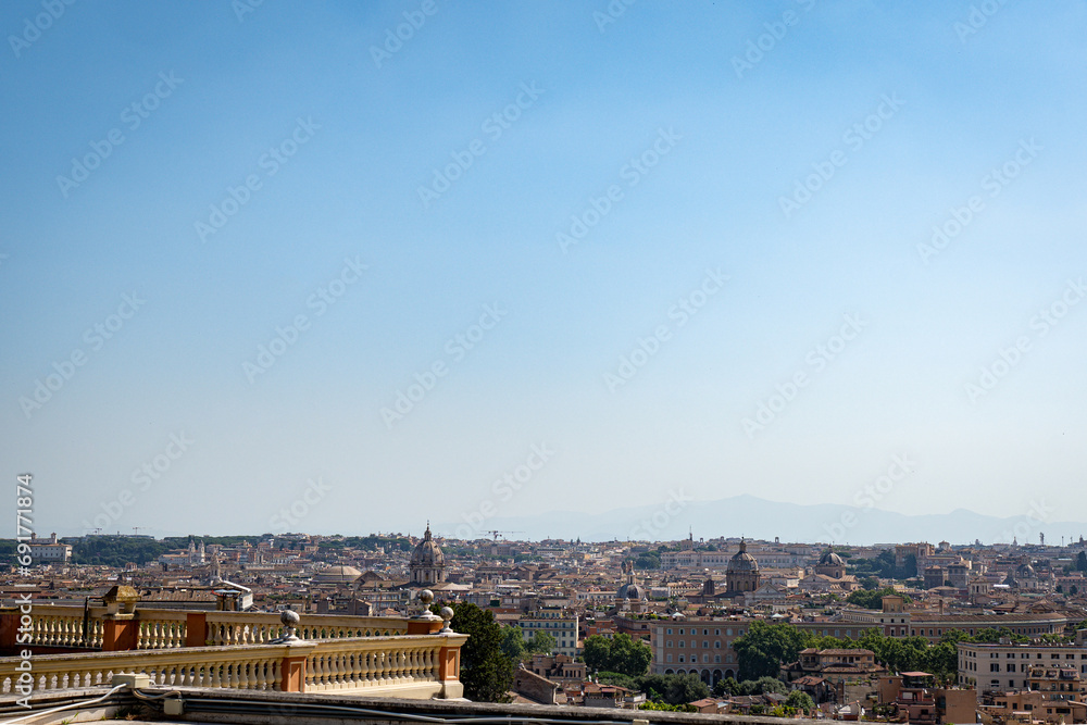 Aerial top view of the center of Rome, Italy. Mountains in the background