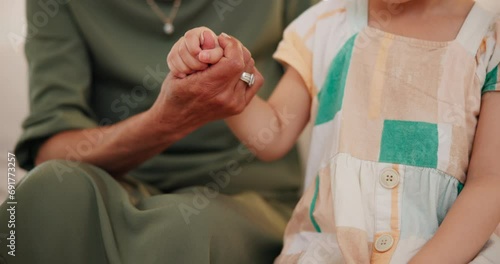 Home, grandmother and girl holding hands, closeup and support with love, empathy or compassion. Bonding together, granny or grandchild with trust, kindness or hope after cancer diagnosis with comfort photo