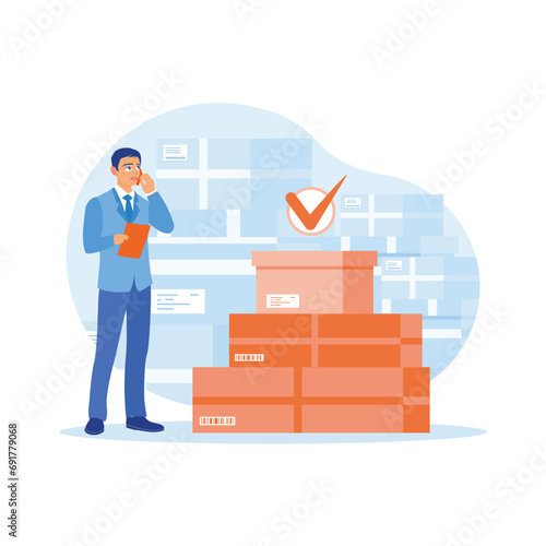 E-commerce business owner reviews goods and customer addresses before shipping goods. The businessman calls the supplier to confirm the order. Order Confirmation concept. 