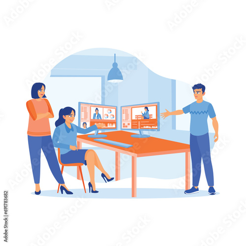 Colleagues are discussing this with the female editor in the office. Working together on a film recording project at a creative start-up agency office. Video Editor concept. 