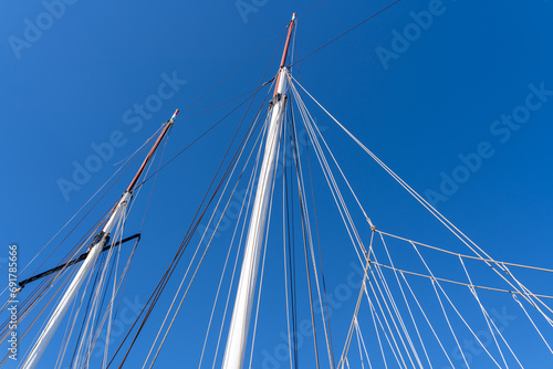 Ropes from sailship with blue sunny sky