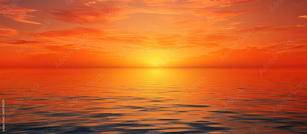 The serene beauty of a sunset as water meets the sky in orange.