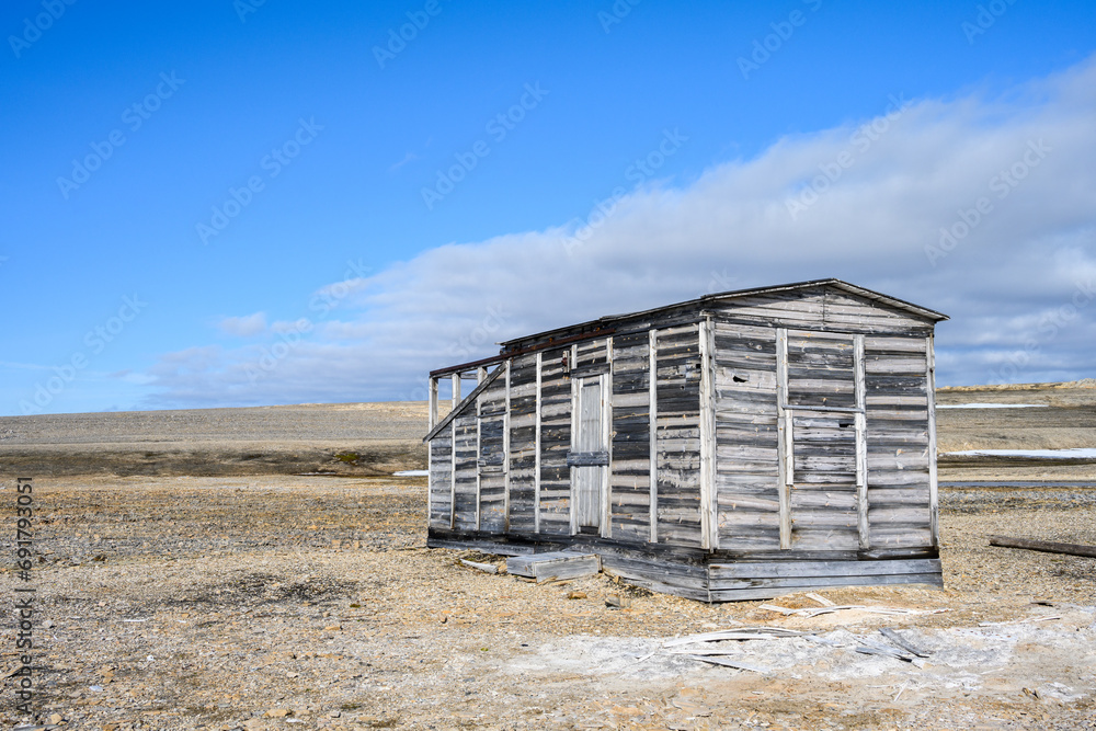 Weathered wood buildings of research station at Kinnvika, Murchison Fjord, Hinlopen Straight on Svalbard in the Arctic
