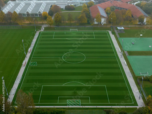 Aerial soccer pitch from a high angle view in the fall season. © allessuper_1979