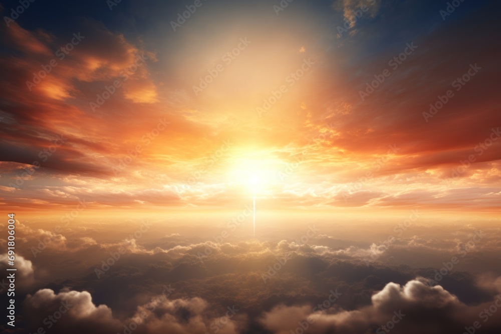 the sun is setting over the clouds and the sky is filled with bright oranges and yellows in the sky. the sun is setting over the clouds and the sky is filled with bright oranges and yellows in the sky.