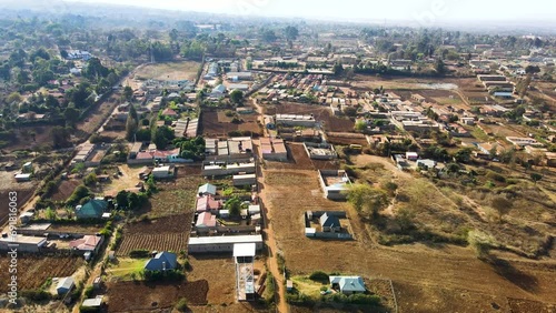 Aerial drone view of rural Kenya settlement. Poor constructed houses.
