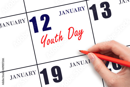 January 12. Hand writing text Youth Day on calendar date. Save the date.