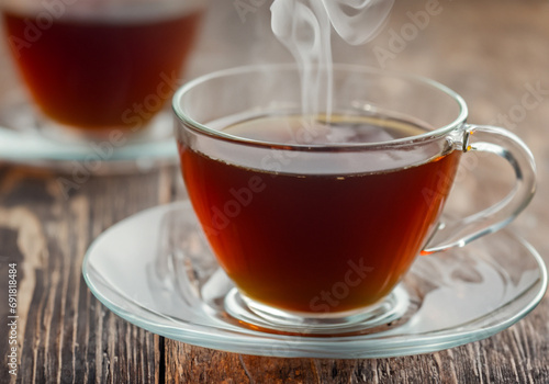 Hot steaming black tea in a cup