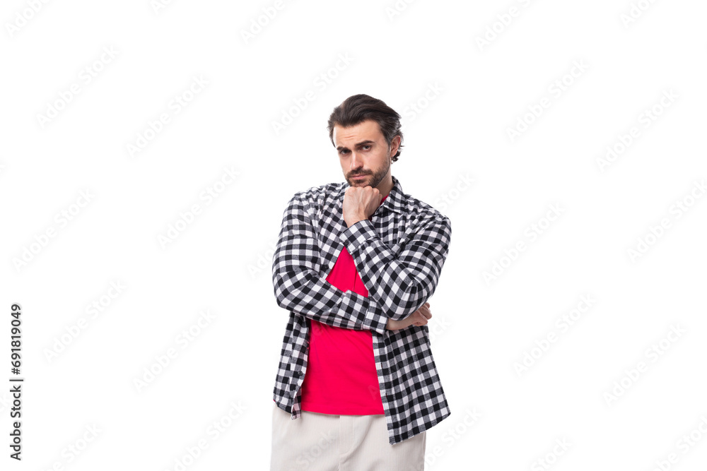Fototapeta premium young smart caucasian handsome guy with a beard and styled hair on a white background with copy space