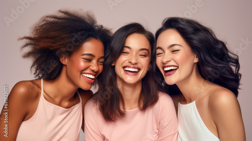 Three beautiful young laughing women of different nationality