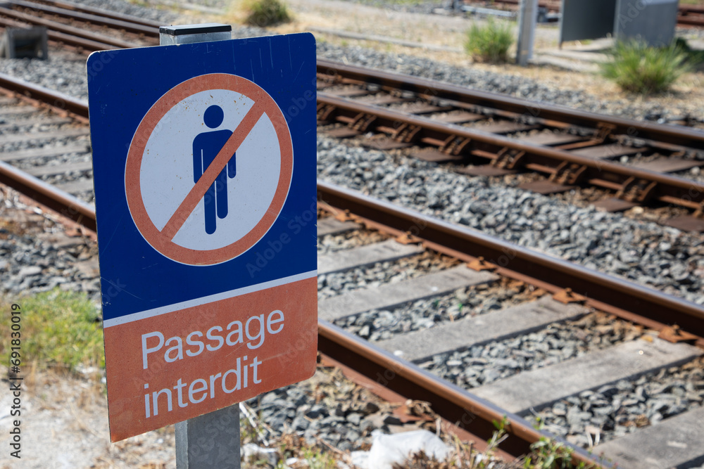 passage interdit french text sign road means pedestrian passage prohibited on the train rails passage interdit french text sign road means pedestrian passage prohibited on the train rails