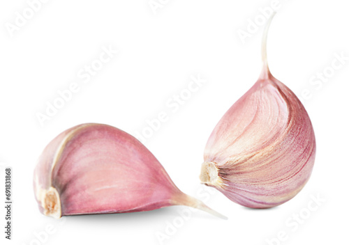 two garlic cloves isolated on a white background