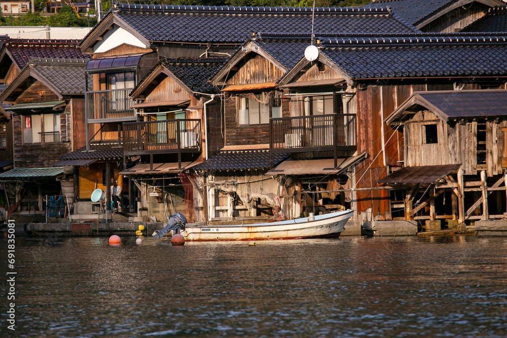 Beautiful fishing village of Ine in the north of Kyoto. Funaya or boat houses are traditional wooden houses built on the seashore. Beautiful fishing village of Ine in the north of Kyoto. Funaya or boat houses are traditional wooden houses built on the seashore.