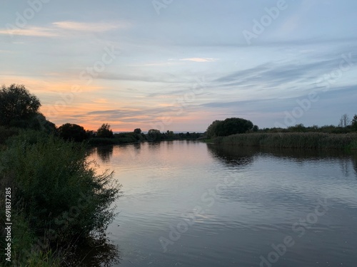 Fototapeta Naklejka Na Ścianę i Meble -  Sunset over the river Emajõgi, Tartu linn, Tartu maakond, Estonia, September 2020