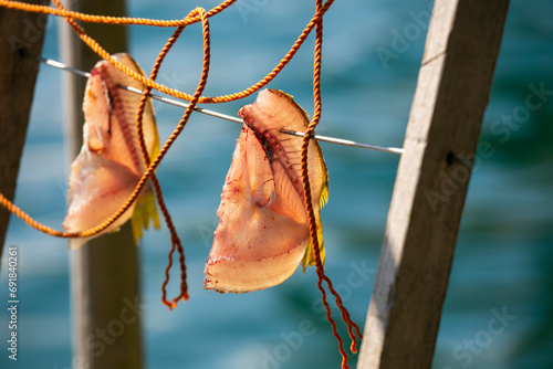 Fish drying hanging in the streets of the the beautiful fishing village of Ine in north of Kyoto. photo