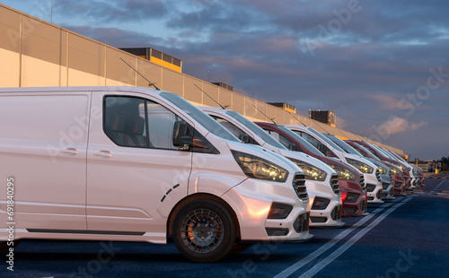 row of generic cargo vans in the parking lot photo