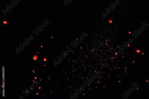 The beauty of the lanterns floating in the sky during the Yi Peng Festival and the Floating Lantern Festival in Chiang Mai Province, Thailand.