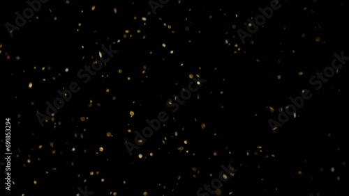 Gold particles celebration motion background. 4K glowing glamour gold dust Animation Video aplha channel photo