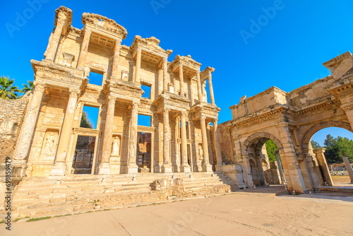 Library of Celsus with intricate carvings and statues evokes sense of grandeur. Library's elegant design with two-story facade and Corinthian columns, fusion of Greek, Roman and Hellenistic influences photo