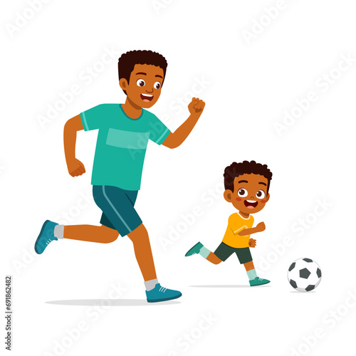 little kid with father play foot ball
